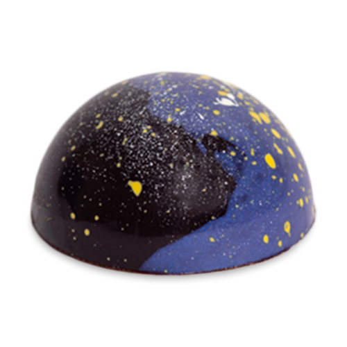 Cardamom Galaxy dome-shaped sugar free chocolate bonbon with blue and dark blue coloring and yellow speckles like stars in the sky