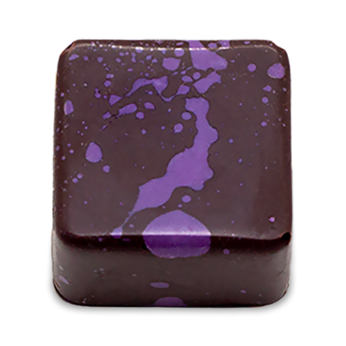 Cardamom Lava sugar free dark chocolate bonbon with purple splattered paint