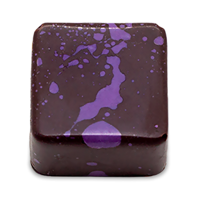 Cardamom Lava sugar free dark chocolate bonbon with purple splattered paint