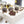 Coffee Shot Truffles with extra dark shell and coffee infused creamy ganache, topped with white chocolate decorative stripes on a white table
