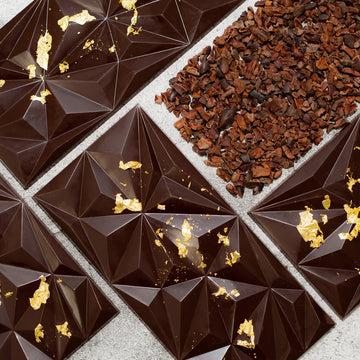 Noir Dream dark chocolate bar with geometric pattern and gold flakes