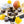 Fruity Caramel dark chocolate bonbons with orange splattered paint and pear jam caramel filing on a white table with yellow roses and pear fruit