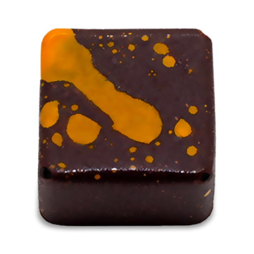 Fruity Caramel sugar free dark chocolate bonbon with orange splattered paint