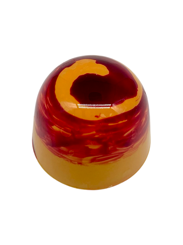 Kumquat gumdrop-shaped sugar free white chocolate bonbon with orange and red spiral design