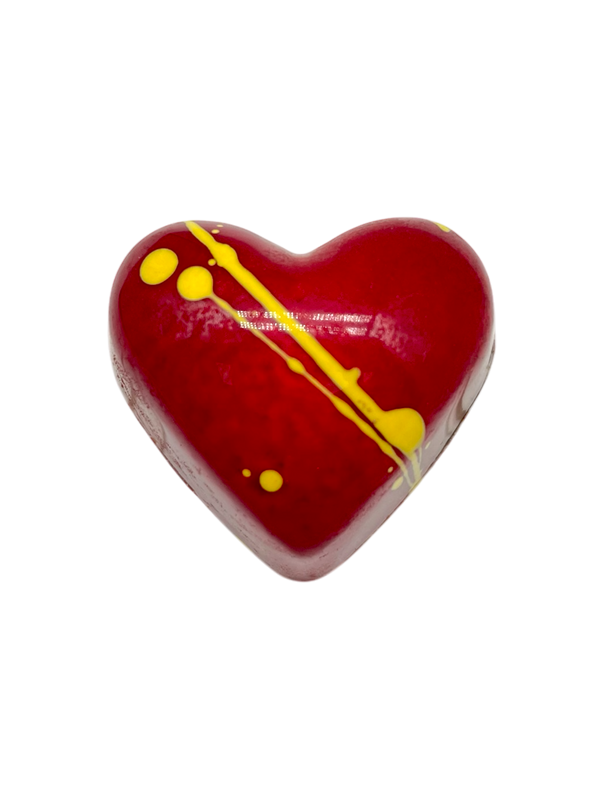 Lychee Bloom heart-shaped sugar free dark chocolate bonbon with red coloring and yellow stripes