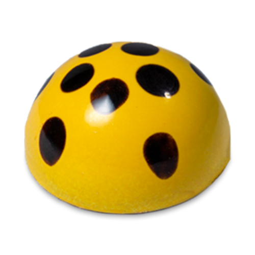 Maracuya Passion Fruit sugar free dark chocolate bonbon, yellow dome-shaped with black dots