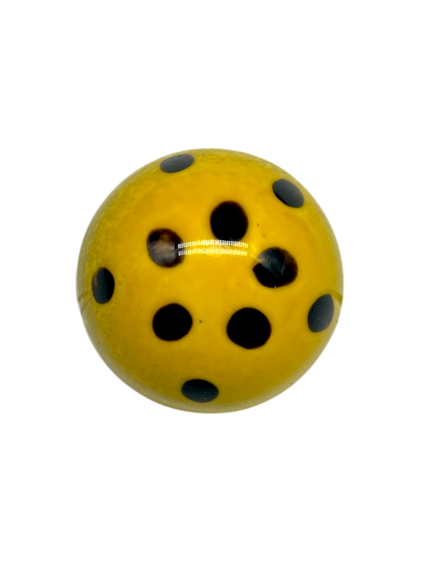 Maracuya Passion Fruit sugar free dark chocolate bonbon, yellow dome-shaped with black dots