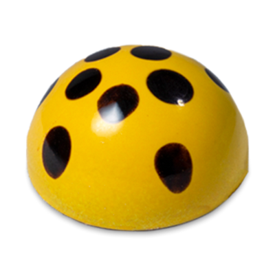 Maracuya Passion Fruit sugar free dark chocolate bonbon, yellow dome-shaped with black dots