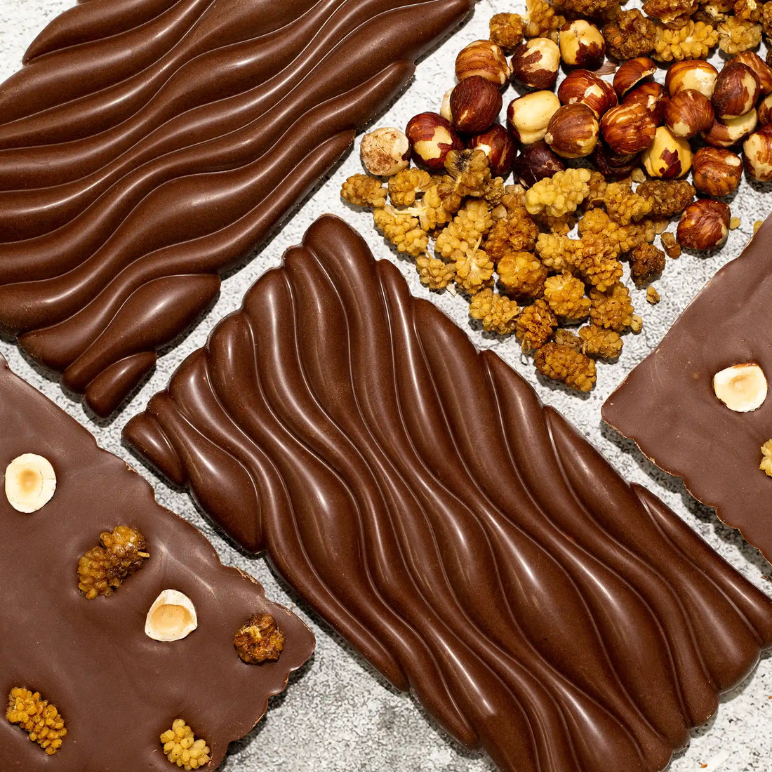 Mulberry Crunch - front wavy pattern and back of Milk Chocolate Bar with mulberries and hazelnuts