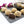 Nutty Lavender Truffles with rich milk chocolate ganache and coated with walnut pieces on a table next to lavender flowers