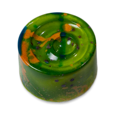 Pistachio Delight sugar free white chocolate bonbon with green coloring and splatters of orange and blue