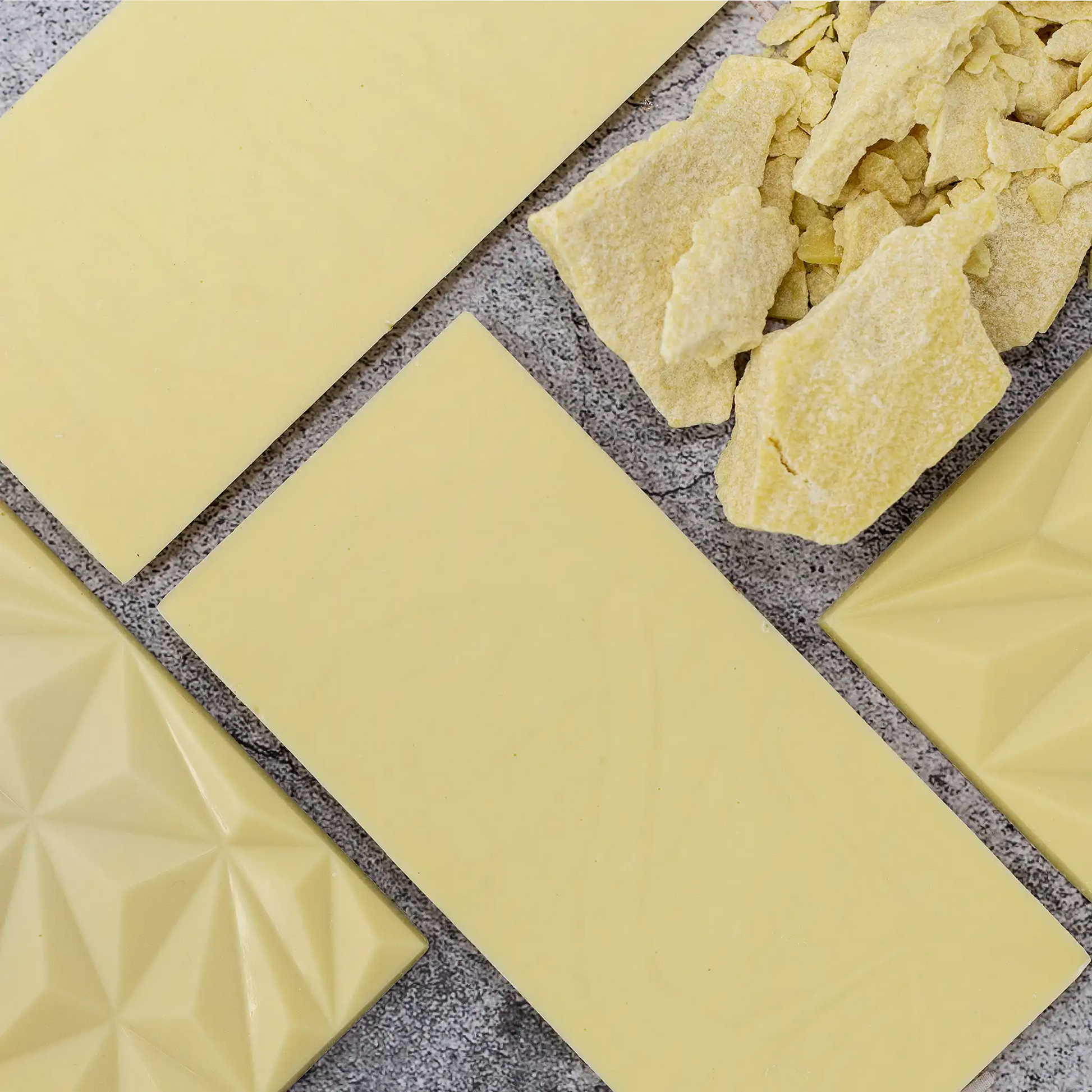 4 White Cream plain white chocolate bars showing front geometric design and flat back