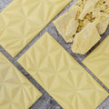 4 White Cream sugar free plain white chocolate bars facing up with geometric design