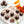 8 Zesty Orange Dark Chocolate Truffles with slices of blood orange on a white table