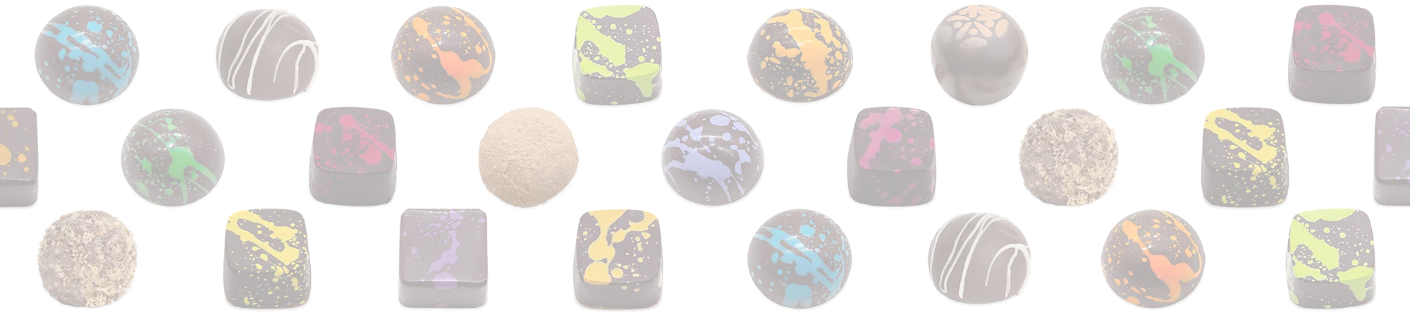 Elite Collection dome and square shaped dark chocolate bonbons with different colored splattered paint on a white background