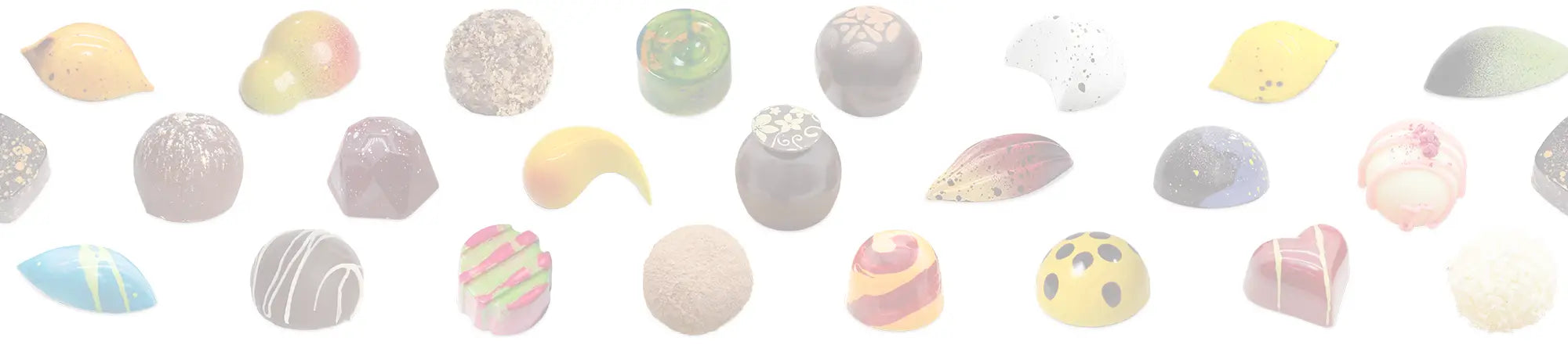 Hand painted luxury chocolate bonbons and decadent truffles on a white background